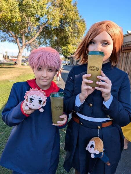 Cosplayers drinking kumquat sugarcane juice at a California night market